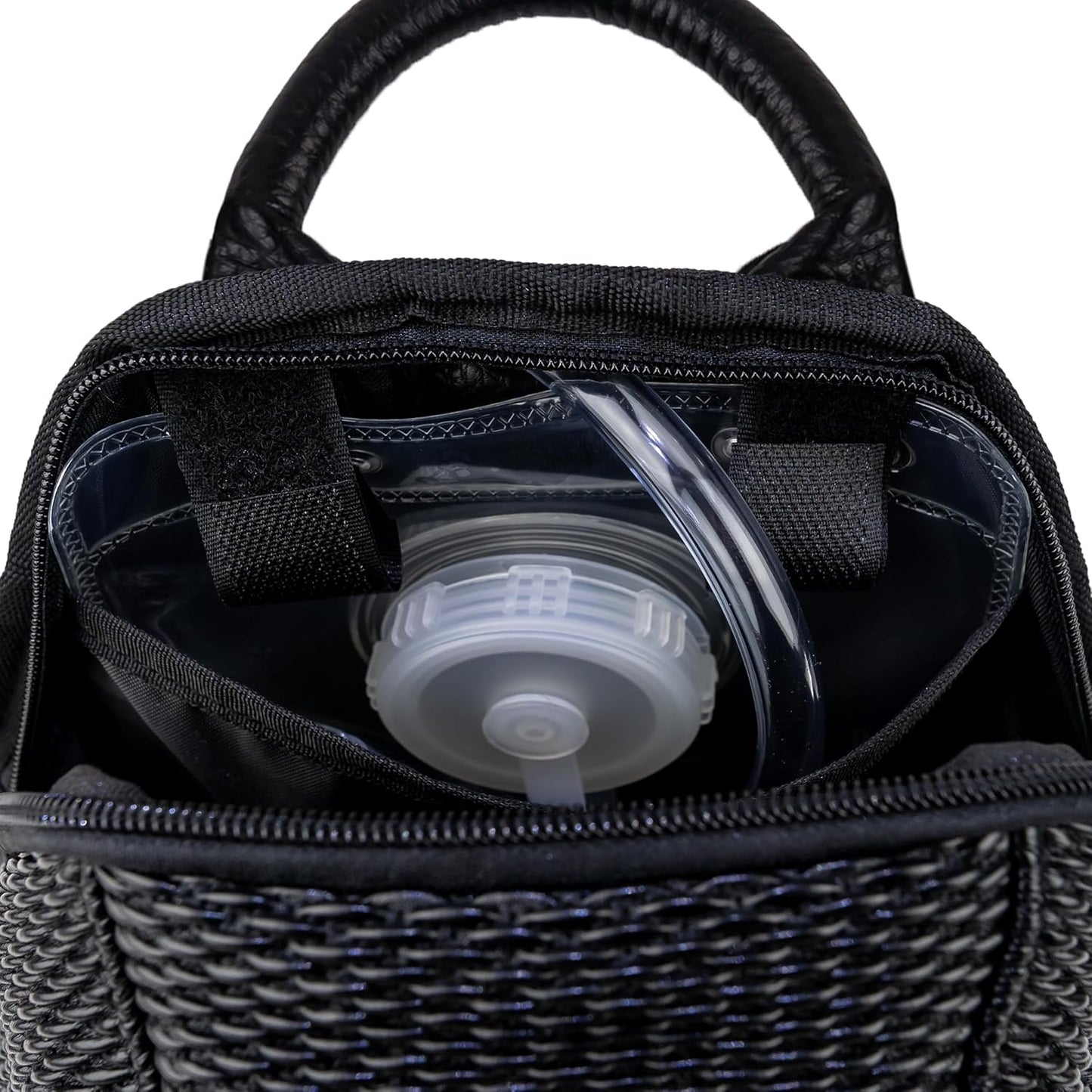 Interior of The Reflective Mini hydration pack with the 1.5L water bladder in the main compartment
