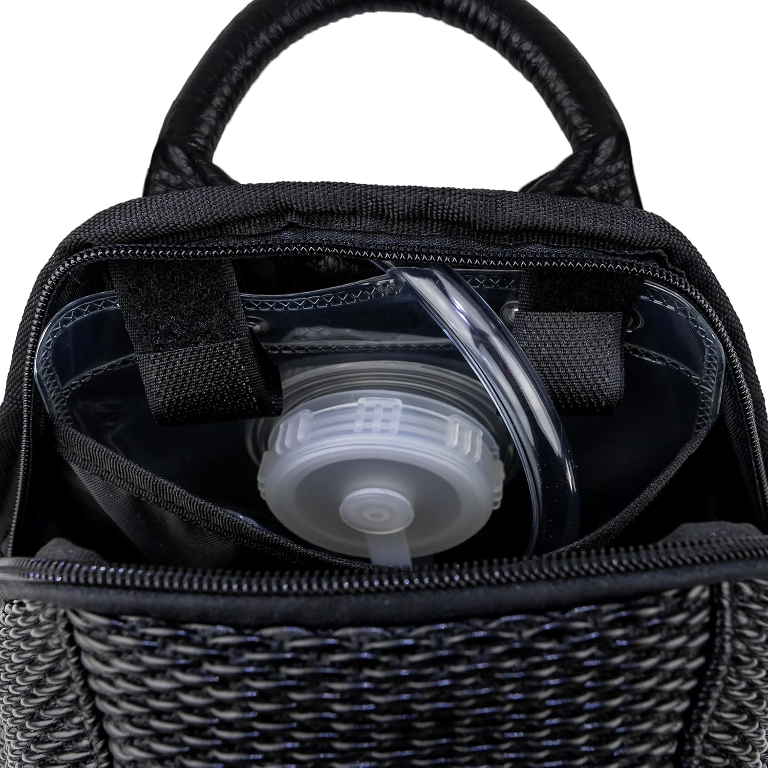 Interior of The Reflective Mini hydration pack with the 1.5L water bladder in the main compartment